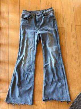 MOTHER Flare Jeans in Washed Blue with Raw Hem